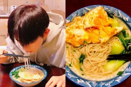 易烊千玺吃长寿面引网友围观生日会上脏辫造型引人关注